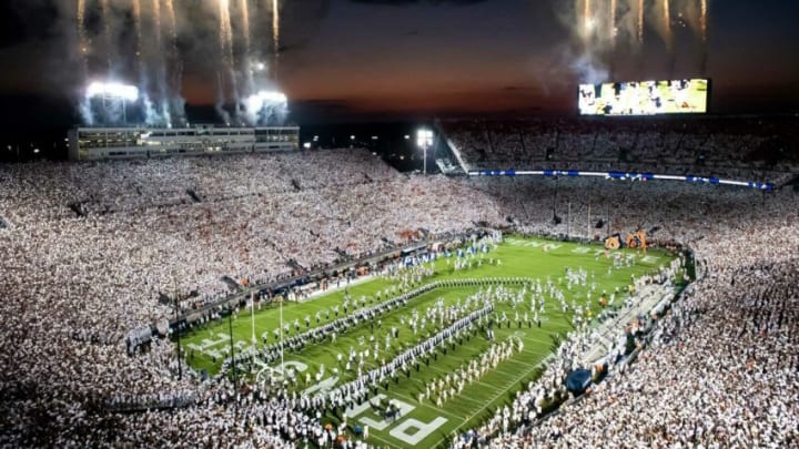 The Penn State football team runs out onto the field to take on Auburn in a White Out game at Beaver Stadium on Saturday, Sept. 18, 2021, in State College.Hes Dr 091821 Pennstate 23