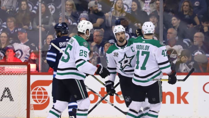 WINNIPEG, MB - MARCH 18: Jamie Benn #14 of the Dallas Stars celebrates his second period against the Winnipeg Jets with teammates Brett Ritchie #25 and Alexander Radulov #47 at the Bell MTS Place on March 18, 2018 in Winnipeg, Manitoba, Canada. (Photo by Darcy Finley/NHLI via Getty Images)