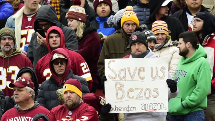 LANDOVER, MD - NOVEMBER 17: A fan holds up a sign for CEO and founder of Amazon Jeff Bezos during a game between the New York Jets and Washington Redskins at FedExField on November 17, 2019 in Landover, Maryland. (Photo by Patrick McDermott/Getty Images)