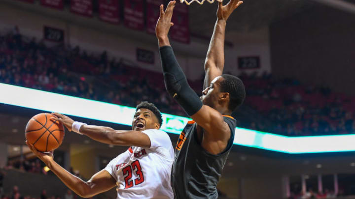 LUBBOCK, TX - FEBRUARY 27: Jarrett Culver #23 of the Texas Tech Red Raiders goes to the basket against Cameron McGriff #12 of the Oklahoma State Cowboys during the second half of the game on February 27, 2019 at United Supermarkets Arena in Lubbock, Texas. Texas Tech defeated Oklahoma State 84-80 in overtime. (Photo by John Weast/Getty Images)