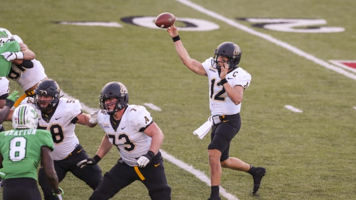 Sep 19, 2020; Huntington, West Virginia, USA; Appalachian State Mountaineers quarterback Zac Thomas (12) passes the ball during the fourth quarter against the Marshall Thundering Herd at Joan C. Edwards Stadium. Mandatory Credit: Ben Queen-USA TODAY Sports