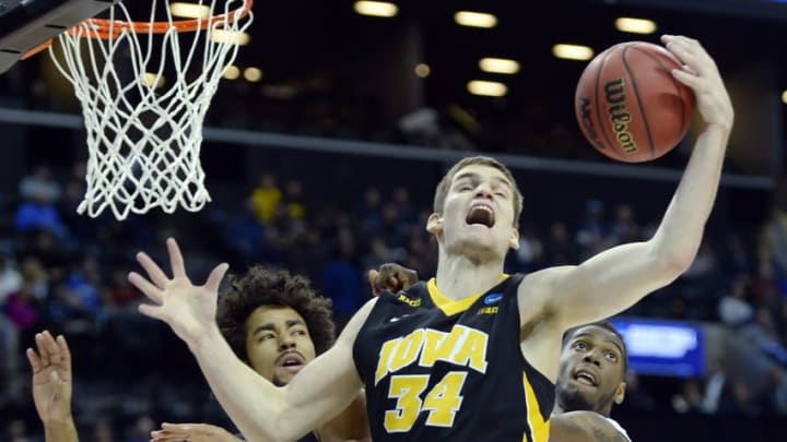 Mar 20, 2016; Brooklyn, NY, USA; Iowa Hawkeyes center Adam Woodbury (34) controls a rebound against the Villanova Wildcats during the first half in the second round of the 2016 NCAA Tournament at Barclays Center. Mandatory Credit: Robert Deutsch-USA TODAY Sports