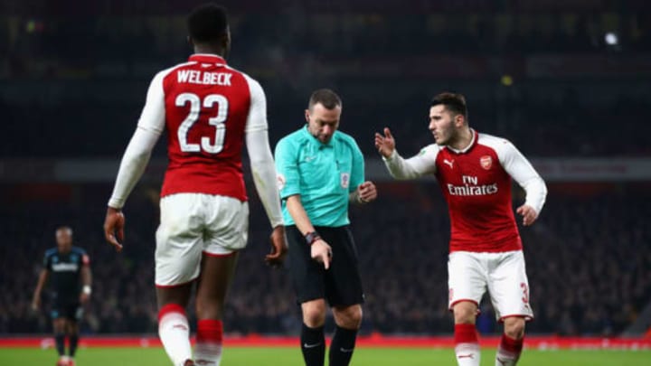 LONDON, ENGLAND – DECEMBER 19: Referee Kevin Friend awards a free kick as Danny Welbeck (23) and Sead Kolasinac of Arsenal appeal during the Carabao Cup Quarter-Final match between Arsenal and West Ham United at Emirates Stadium on December 19, 2017 in London, England. (Photo by Julian Finney/Getty Images)