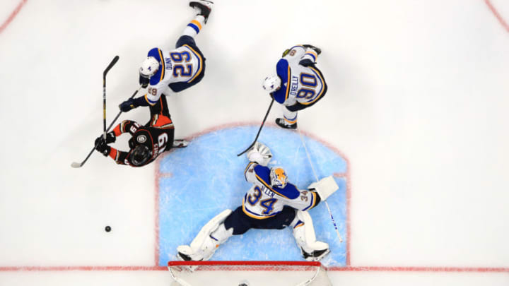 ANAHEIM, CALIFORNIA - MARCH 11: Jake Allen #34, Ryan O'Reilly #90 and Vince Dunn #29 of the St. Louis Blues defend against Max Jones #49 of the Anaheim Ducks during the first period of a game at Honda Center on March 11, 2020 in Anaheim, California. (Photo by Sean M. Haffey/Getty Images)