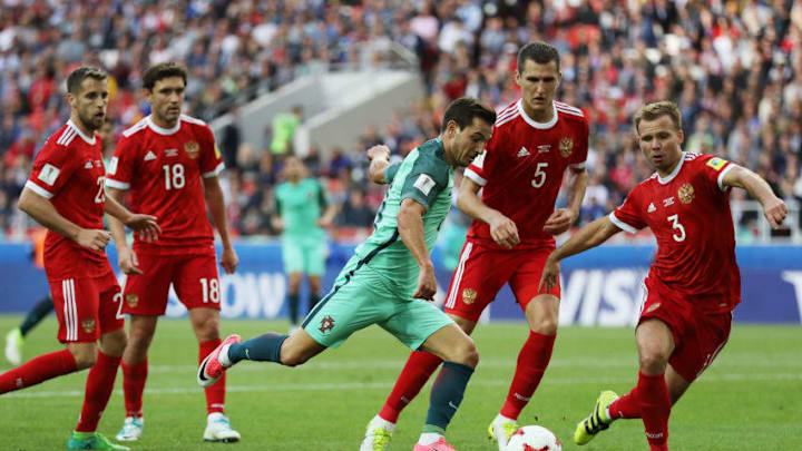MOSCOW, RUSSIA - JUNE 21: Cedric of Portugal attempts to shoot while he is closed down by the Russia defence during the FIFA Confederations Cup Russia 2017 Group A match between Russia and Portugal at Spartak Stadium on June 21, 2017 in Moscow, Russia. (Photo by Francois Nel/Getty Images)
