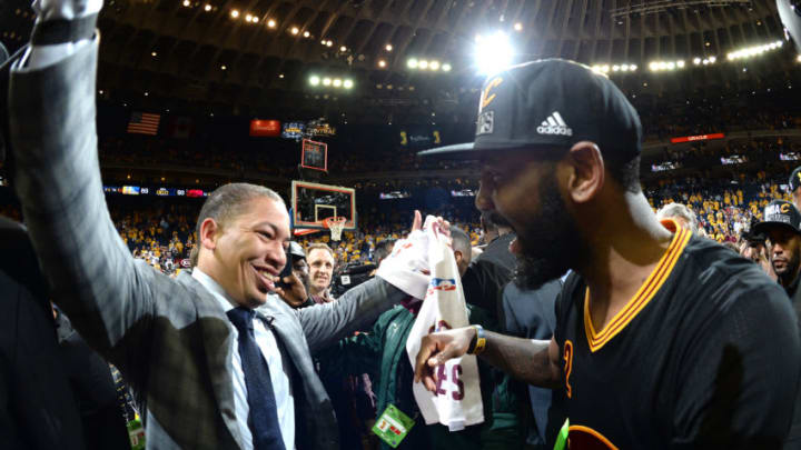 OAKLAND, CA - JUNE 19: Head coach Tyronn Lue celebrates with Kyrie Irving