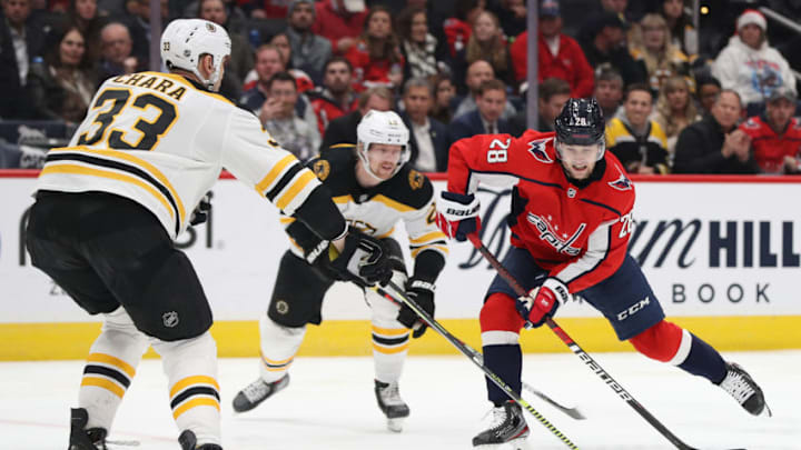 WASHINGTON, DC - DECEMBER 11: Brendan Leipsic #28 of the Washington Capitals skates in front of Zdeno Chara #33 of the Boston Bruins during the second period at Capital One Arena on December 11, 2019 in Washington, DC. (Photo by Patrick Smith/Getty Images)