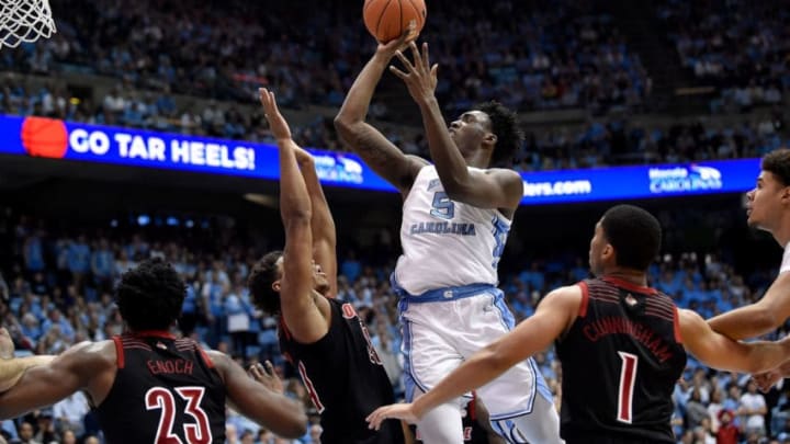 CHAPEL HILL, NORTH CAROLINA - JANUARY 12: Nassir Little #5 of the North Carolina Tar Heels shoots over Dwayne Sutton #24 of the Louisville Cardinals during the second half of their game at the Dean Smith Center on January 12, 2019 in Chapel Hill, North Carolina. Louisville won 83-62. (Photo by Grant Halverson/Getty Images)