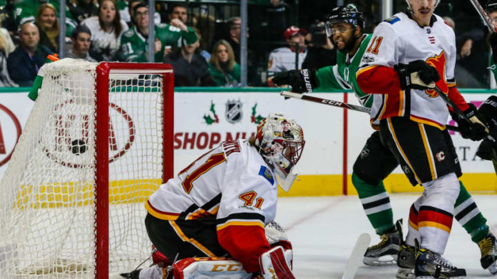 DALLAS, TX - NOVEMBER 24: Dallas Stars center Gemel Smith (46) gets the puck up and over Calgary Flames goalie Mike Smith (41) for a goal during the game between the Dallas Stars and the Calgary Flames on November 24, 2017 at the American Airlines Center in Dallas, Texas. Dallas beats Calgary 6-3. (Photo by Matthew Pearce/Icon Sportswire via Getty Images)