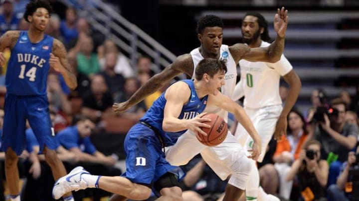 March 24, 2016; Anaheim, CA, USA; Duke Blue Devils guard Grayson Allen (3) moves the ball against Oregon Ducks forward Jordan Bell (1) during the second half of the semifinal game in the West regional of the NCAA Tournament at Honda Center. Mandatory Credit: Robert Hanashiro-USA TODAY Sports