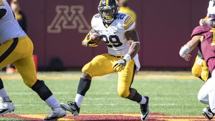 Oct 8, 2016; Minneapolis, MN, USA; Iowa Hawkeyes running back LeShun Daniels Jr. (29) rushes for a first down in the second half against the Minnesota Golden Gophers at TCF Bank Stadium. The Hawkeyes won 14-7. Mandatory Credit: Jesse Johnson-USA TODAY Sports