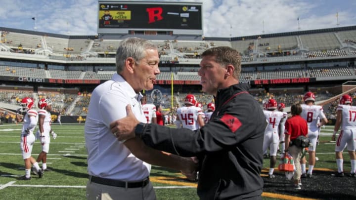 IOWA CITY, IOWA- SEPTEMBER 7: Head coach Kirk Ferentz of the Iowa Hawkeyes visits with head coach Chris Ash of the Rutgers Scarlet Knights before their match-up on September 7, 2019 at Kinnick Stadium in Iowa City, Iowa. (Photo by Matthew Holst/Getty Images)