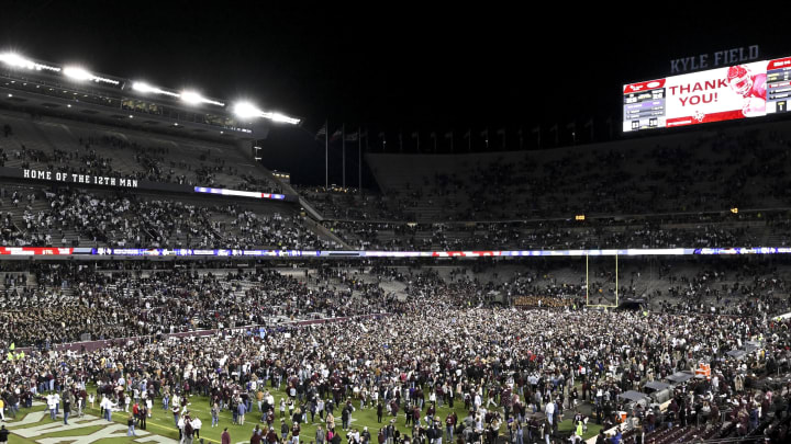 Nov 26, 2022; College Station, Texas, USA; Fans rush the field after the Texas A&M Aggies defeat the LSU Tigers at Kyle Field. Mandatory Credit: Maria Lysaker-USA TODAY Sports