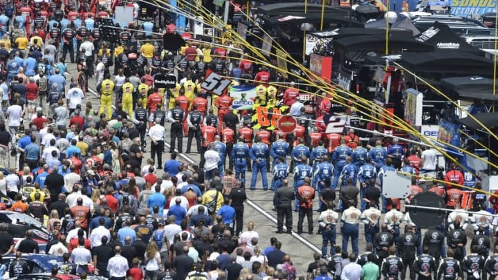 Jul 19, 2015; Loudon, NH, USA; Crews line up for the national anthem before the 5-Hour Energy 301 at New Hampshire Motor Speedway. Mandatory Credit: Jasen Vinlove-USA TODAY Sports