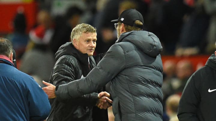 Manchester United's manager Ole Gunnar Solskjaer and Liverpool's manager Jurgen Klopp (Photo by OLI SCARFF/AFP via Getty Images)