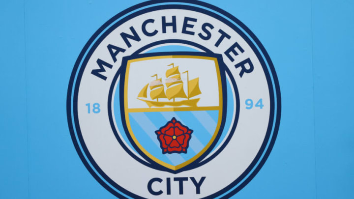 MANCHESTER, ENGLAND - FEBRUARY 12: The club badge of Manchester City is seen outside the Etihad Stadium during the Premier League match between Manchester City and Aston Villa at Etihad Stadium on February 12, 2023 in Manchester, England. (Photo by James Gill - Danehouse/Getty Images)