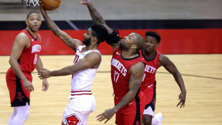 HOUSTON, TEXAS - FEBRUARY 22: Coby White #0 of the Chicago Bulls shoots a lay up ahead of P.J. Tucker #17 of the Houston Rockets during the third quarter of a game at the Toyota Center on February 22, 2021 in Houston, Texas. NOTE TO USER: User expressly acknowledges and agrees that, by downloading and or using this photograph, User is consenting to the terms and conditions of the Getty Images License Agreement. (Photo by Carmen Mandato/Getty Images)
