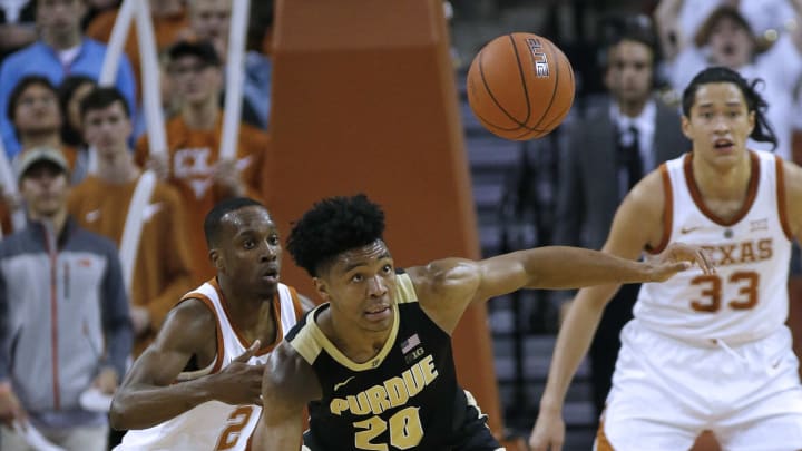 AUSTIN, TX – DECEMBER 9: Nojel Eastern #20 of the Purdue Boilermakers eyes the loose ball in front of Matt Coleman III #2 of the Texas Longhorns at the Frank Erwin Center on December 9, 2018 in Austin, Texas. (Photo by Chris Covatta/Getty Images)