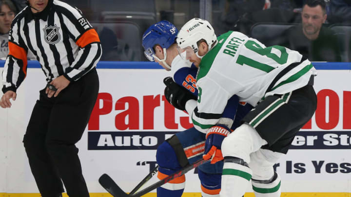 Mar 19, 2022; Elmont, New York, USA; New York Islanders center Casey Cizikas (53) and Dallas Stars left wing Michael Raffl (18) battle for a loose puck during the second period at UBS Arena. Mandatory Credit: Andy Marlin-USA TODAY Sports
