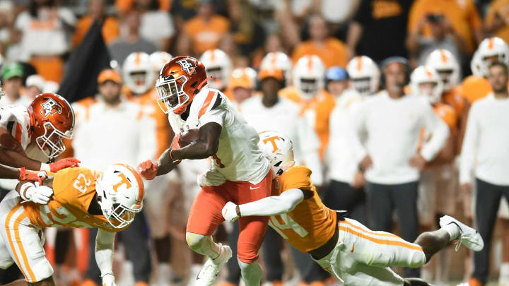 Bowling Green cornerback Davon Ferguson (7) is tackled by Tennessee defensive back Christian Charles (14) during the NCAA college football game between the Tennessee Volunteers and Bowling Green Falcons in Knoxville, Tenn. on Thursday, September 2, 2021.Ut Bowling Green