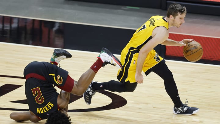 MIAMI, FLORIDA – MARCH 16: Goran Dragic #7 of the Miami Heat dribbles past Collin Sexton #2 of the Cleveland Cavaliers during the fourth quarter at American Airlines Arena on March 16, 2021 in Miami, Florida. NOTE TO USER: User expressly acknowledges and agrees that, by downloading and or using this photograph, User is consenting to the terms and conditions of the Getty Images License Agreement. (Photo by Michael Reaves/Getty Images)