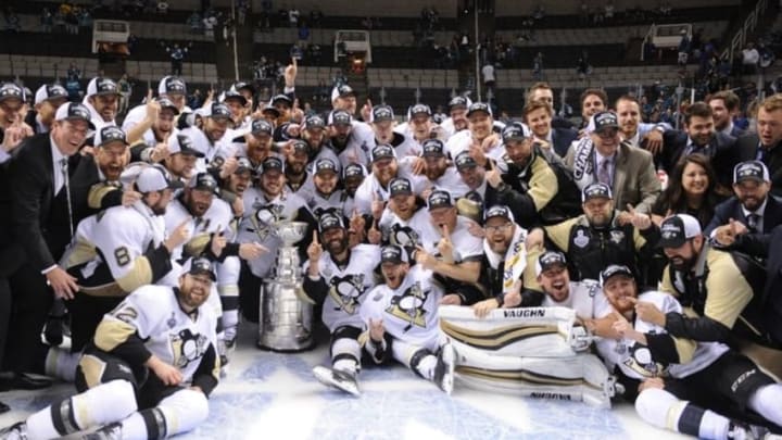 Jun 12, 2016; San Jose, CA, USA; Pittsburgh Penguins players pose for a team photo with the Stanley Cup after defeating the San Jose Sharks in game six of the 2016 Stanley Cup Final at SAP Center at San Jose. Mandatory Credit: Gary A. Vasquez-USA TODAY Sports
