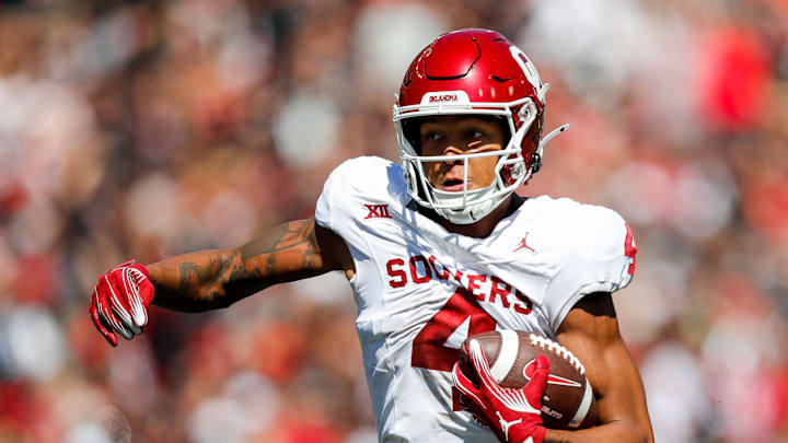 Sep 23, 2023; Cincinnati, Ohio, USA; Oklahoma Sooners wide receiver Nic Anderson (4) runs with the ball against the Cincinnati Bearcats in the first half at Nippert Stadium. Mandatory Credit: Katie Stratman-USA TODAY Sports