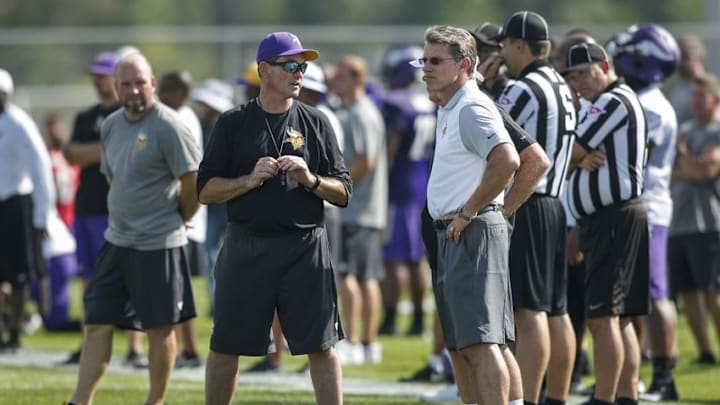 Jul 27, 2015; Mankato, MN, USA; Minnesota Vikings head coach Mike Zimmer speaks with general manager Rick Spielman at training camp at Minnesota State University. Mandatory Credit: Bruce Kluckhohn-USA TODAY Sports