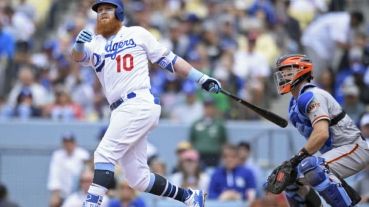 LOS ANGELES, CA - JUNE 17: Justin Turner #10 of the Los Angeles Dodgers watches a ball go foul while Nick Hundley #5 of the San Francisco Giants looks on in the sixth inning at Dodger Stadium on June 17, 2018 in Los Angeles, California. (Photo by John McCoy/Getty Images)