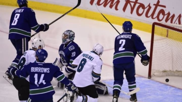 Mar 3, 2016; Vancouver, British Columbia, CAN; San Jose Sharks defenseman Brent Burns (88) (not pictured) scores against Vancouver Canucks goaltender Ryan Miller (30) during the third period at Rogers Arena. The San Jose Sharks won 3-2. Mandatory Credit: Anne-Marie Sorvin-USA TODAY Sports