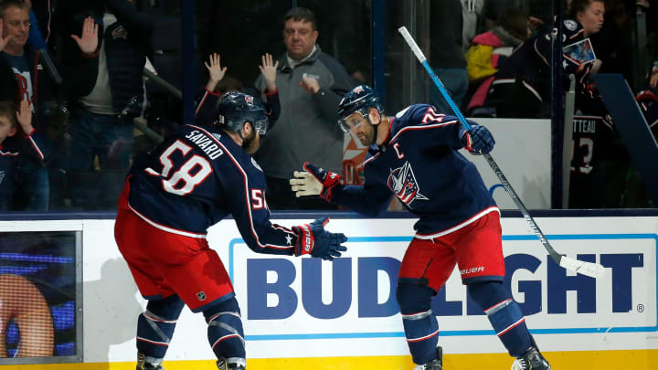 COLUMBUS, OH – FEBRUARY 24: David Savard #58 of the Columbus Blue Jackets and Nick Foligno #71 celebrate after defeating the Ottawa Senators in overtime on February 24, 2020 at Nationwide Arena in Columbus, Ohio. Columbus defeated Ottawa 4-3 in overtime. (Photo by Kirk Irwin/Getty Images)