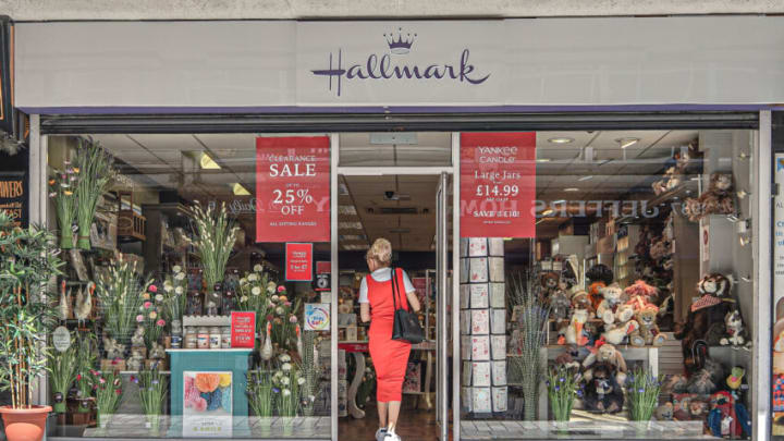 BELFAST, UNITED KINGDOM - 2021/05/31: A lady in a red dress enters Hallmark Card Shop on College Street. (Photo by Michael McNerney/SOPA Images/LightRocket via Getty Images)