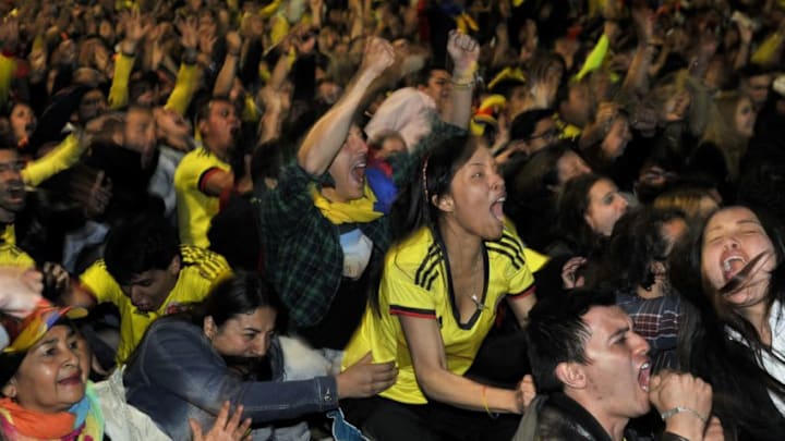 Colombian fans celebrate during the fan fest live broadcast of the Copa America football match between Brazil and Colombia, at a square of Bogota, on June 17, 2015. Colombia won 1-0. AFP PHOTO/Guillermo LEGARIA (Photo credit should read GUILLERMO LEGARIA/AFP/Getty Images)