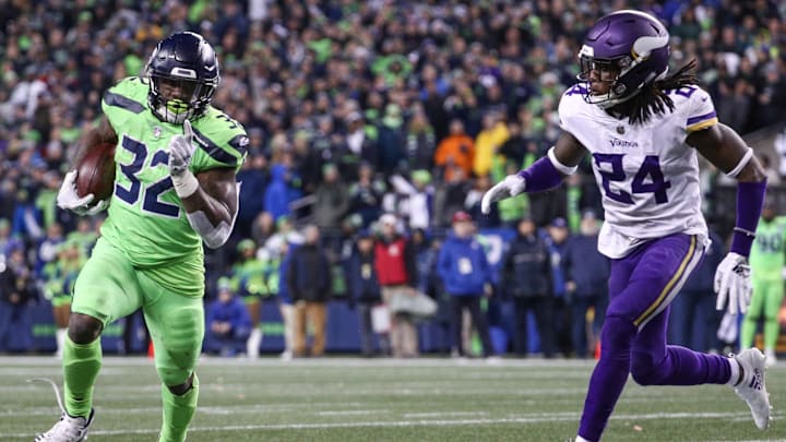 SEATTLE, WA - DECEMBER 10: Chris Carson #32 of the Seattle Seahawks runs the ball past Holton Hill #24 of the Minnesota Vikings in the fourth quarter at CenturyLink Field on December 10, 2018 in Seattle, Washington. (Photo by Abbie Parr/Getty Images)