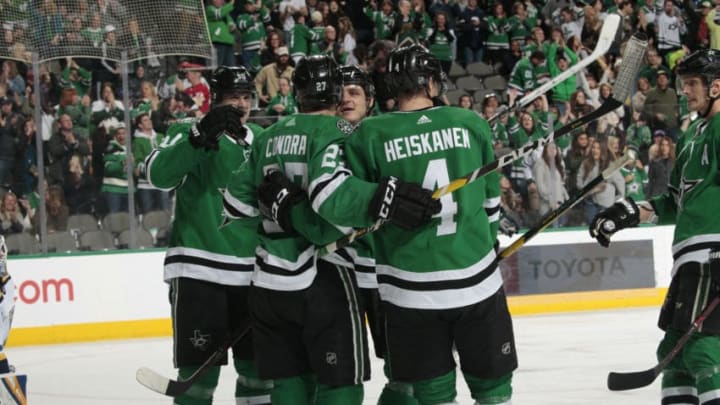 DALLAS, TX - JANUARY 12: Erik Condra #27, Miro Heiskanen #4, Jason Spezza #90 and the Dallas Stars celebrate a goal against the St. Louis Blues at the American Airlines Center on January 12, 2019 in Dallas, Texas. (Photo by Glenn James/NHLI via Getty Images)