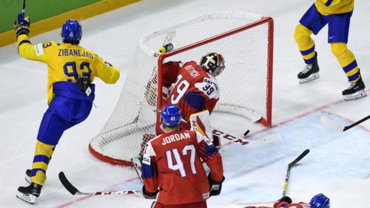 Sweden's Mika Zibanejad (L) celebrates after scoring past Czech Republic's goalie David Rittich during the group A match Sweden vs Czech Republic of the 2018 IIHF Ice Hockey World Championship at the Royal Arena in Copenhagen, Denmark, on May 6, 2018. (Photo by Jonathan NACKSTRAND / AFP) (Photo credit should read JONATHAN NACKSTRAND/AFP/Getty Images)