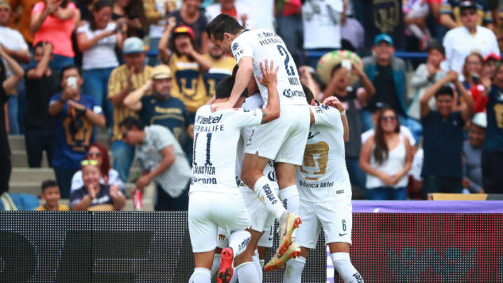 MEXICO CITY, MEXICO - SEPTEMBER 16: Pablo Barrera #8 of Pumas celebrate with teammates after scoring the third goal of his team during the 9th round match between Pumas UNAM and Lobos BUAP as part of the Torneo Apertura 2018 Liga MX at Olimpico Universitario Stadium on September 16, 2018 in Mexico City, Mexico. (Photo by Hector Vivas/Getty Images)