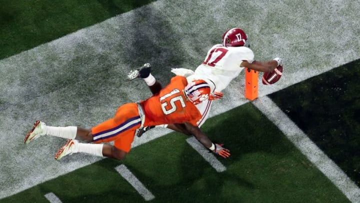Jan 11, 2016; Glendale, AZ, USA; Alabama Crimson Tide running back Kenyan Drake (17) dives for a touchdown on a 95 yard kick off return defended by Clemson Tigers safety T.J. Green (15) during the fourth quarter in the 2016 CFP National Championship at University of Phoenix Stadium. Mandatory Credit: Erich Schlegel-USA TODAY Sports