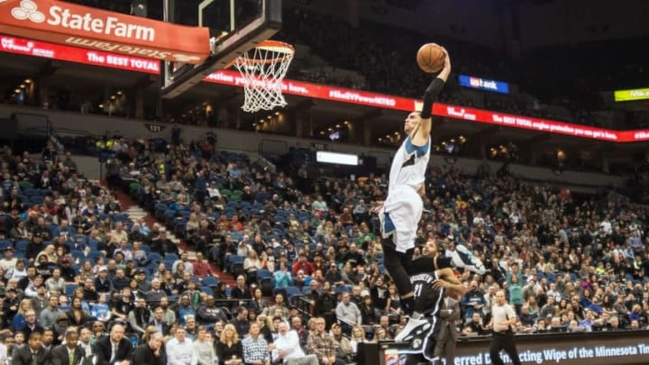 Mar 5, 2016; Minneapolis, MN, USA; Minnesota Timberwolves guard Zach LaVine (8) dunks as Brooklyn Nets guard Wayne Ellington (21) looks on during the second quarter at Target Center. Mandatory Credit: Jeffrey Becker-USA TODAY Sports