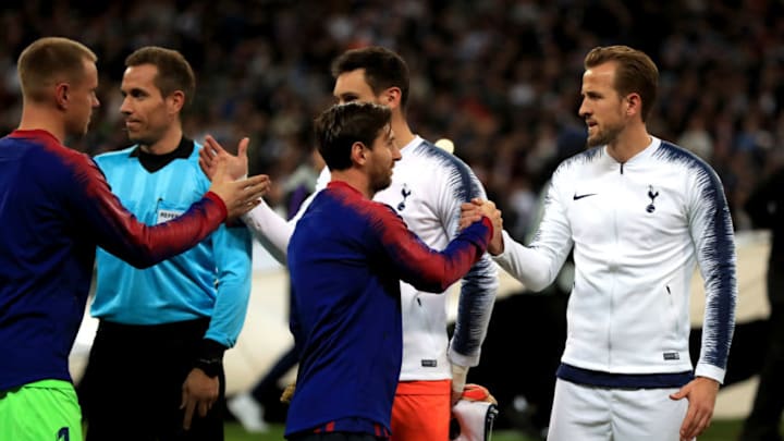 Barcelona's Lionel Messi (centre) shakes hands with Tottenham Hotspur's Harry Kane (right) (Photo by Mike Egerton/PA Images via Getty Images)