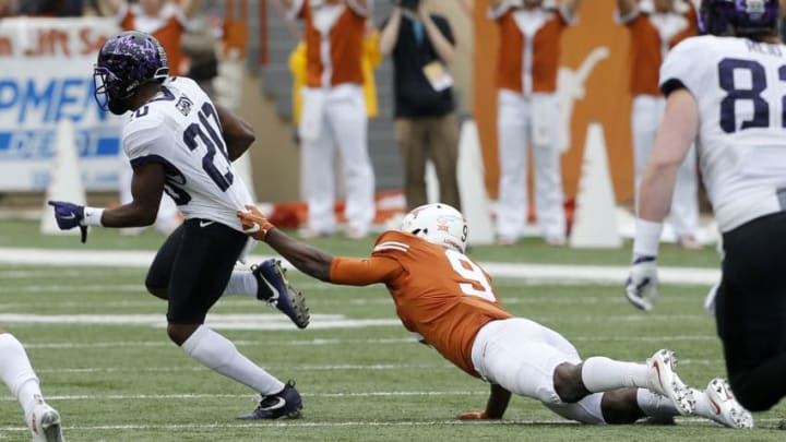 AUSTIN, TX - NOVEMBER 25: Davante Davis #9 of the Texas Longhorns grabs the jersey of Deante Gray #20 of the TCU Horned Frogs at Darrell K Royal -Texas Memorial Stadium on November 25, 2016 in Austin, Texas. (Photo by Chris Covatta/Getty Images)
