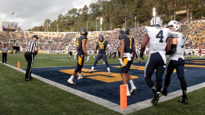 Nov 29, 2014; Berkeley, CA, USA; California Golden Bears wide receiver Kenny Lawler (4), wide receiver Darius Powe (10) and wide receiver Bryce Treggs (1) celebrate after a touchdown against the Brigham Young Cougars during the second quarter at Memorial Stadium. Mandatory Credit: Kelley L Cox-USA TODAY Sports