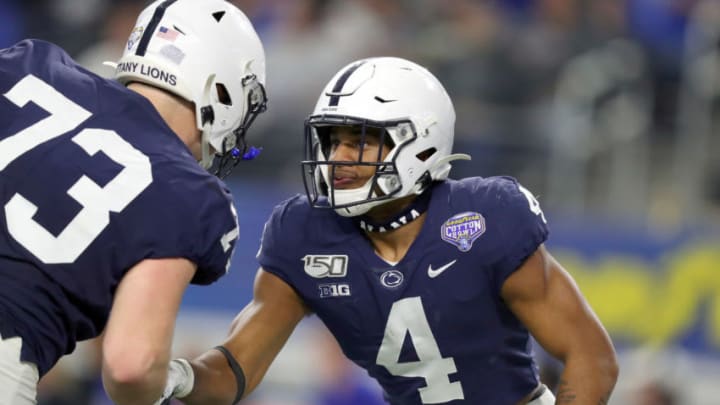 ARLINGTON, TEXAS - DECEMBER 28: Journey Brown #4 of the Penn State Nittany Lions celebrates with Mike Miranda #73 of the Penn State Nittany Lions after scoring a touchdown against the Memphis Tigers in the second quarter at AT&T Stadium on December 28, 2019 in Arlington, Texas. (Photo by Tom Pennington/Getty Images)