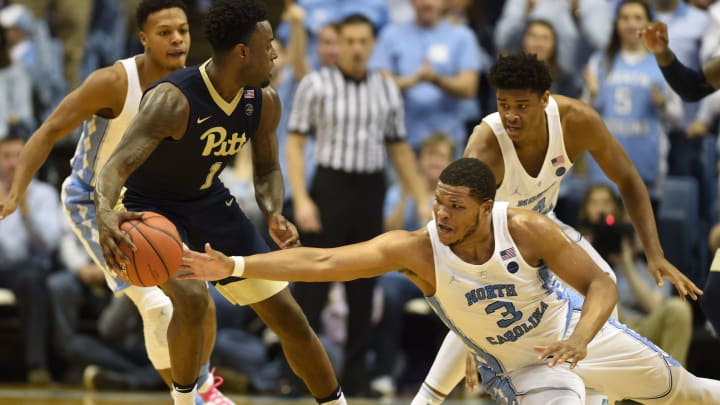 Jan 31, 2017; Chapel Hill, NC, USA; Pittsburgh Panthers forward Jamel Artis (1) with the ball as North Carolina Tar Heels forward Kennedy Meeks (3) defends in the second half. The Tar Heels defeated the Panthers 80-78 at Dean E. Smith Center. Mandatory Credit: Bob Donnan-USA TODAY Sports