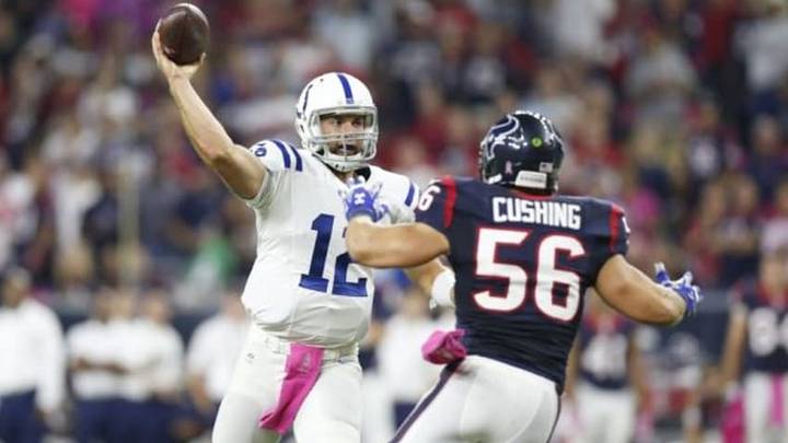 Oct 9, 2014; Houston, TX, USA; Indianapolis Colts quarterback Andrew Luck (12) throws in the pocket against Houston Texans linebacker linebacker Brian Cushing (56) at NRG Stadium. Mandatory Credit: Matthew Emmons-USA TODAY Sports