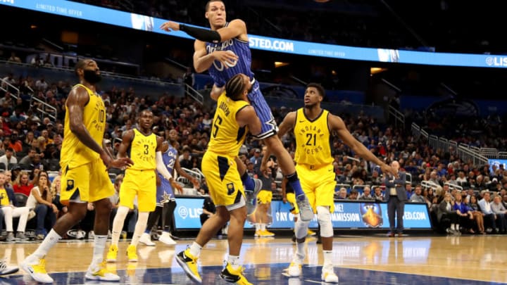 ORLANDO, FLORIDA - DECEMBER 07: Aaron Gordon #00 of the Orlando Magic makes a pass over Cory Joseph #6 of the Indiana Pacers during the game at Amway Center on December 07, 2018 in Orlando, Florida. NOTE TO USER: User expressly acknowledges and agrees that, by downloading and or using this photograph, User is consenting to the terms and conditions of the Getty Images License Agreement. (Photo by Sam Greenwood/Getty Images)