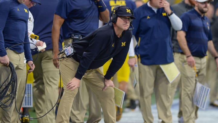 ATLANTA, GA DECEMBER 29: Michigan head coach Jim Harbaugh watches form the sideline during the first half of the Chick-fil-A Peach Bowl between the Michigan Wolverines and the Florida Gators on December 29th, 2018 at Mercedes-Benz Stadium in Atlanta, GA. (Photo by Rich von Biberstein/Icon Sportswire via Getty Images)
