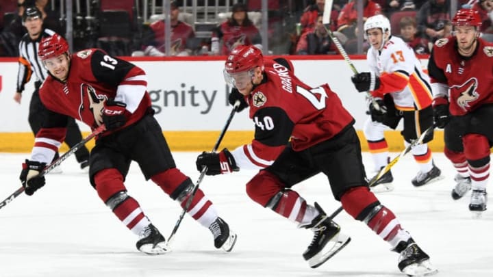 GLENDALE, AZ - MARCH 07: Michael Grabner #40 of the Arizona Coyotes advances the puck up ice against the Calgary Flames during the third period at Gila River Arena on March 7, 2019 in Glendale, Arizona. (Photo by Norm Hall/NHLI via Getty Images)