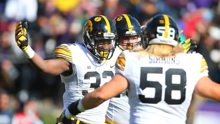 Oct 17, 2015; Evanston, IL, USA; Iowa Hawkeyes running back Derrick Mitchell Jr. (32) celebrates with offensive lineman Eric Simmons (58) after scoring a touchdown during the second half of the game at Ryan Field. Mandatory Credit: Caylor Arnold-USA TODAY Sports