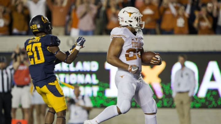 BERKELEY, CA - SEPTEMBER 17: Running back Chris Warren III #25 of the Texas Longhorns scores a touchdown against cornerback Josh Drayden #20 of the California Golden Bears in the first quarter on September 17, 2016 at California Memorial Stadium in Berkeley, California. Cal won 50-43. (Photo by Brian Bahr/Getty Images)